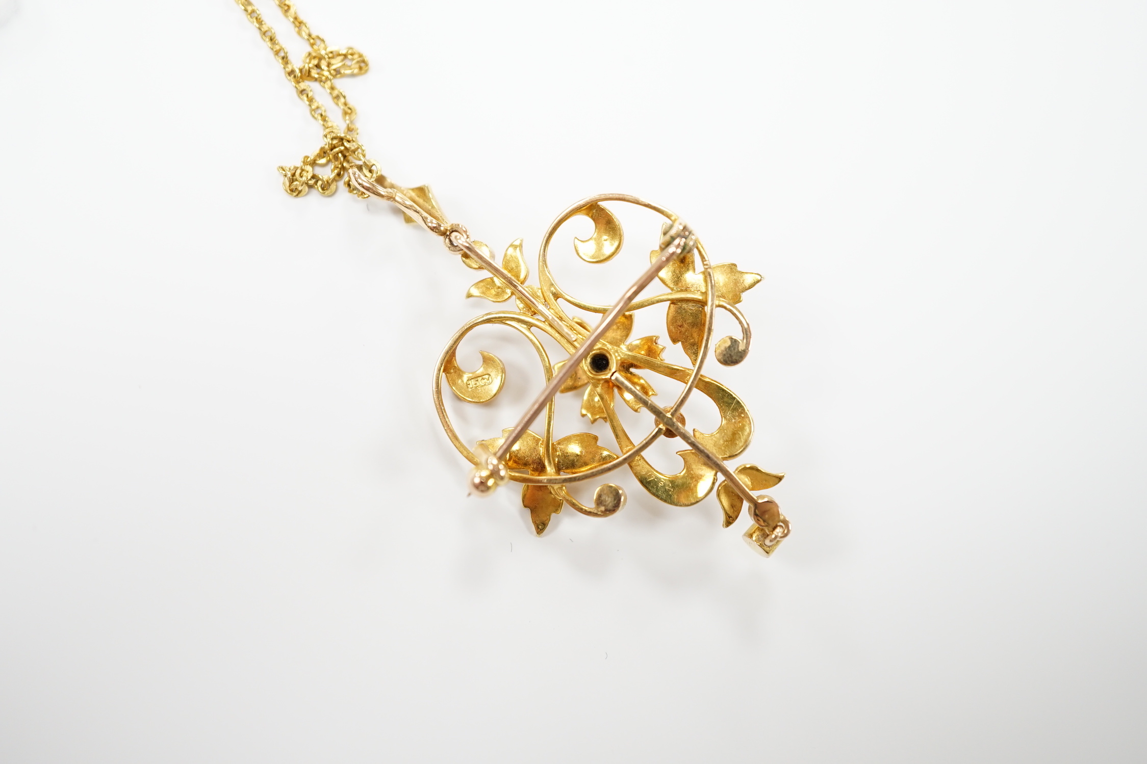An Edwardian 15ct and seed pearl cluster set drop pendant brooch, 40mm on a later 375 chain.